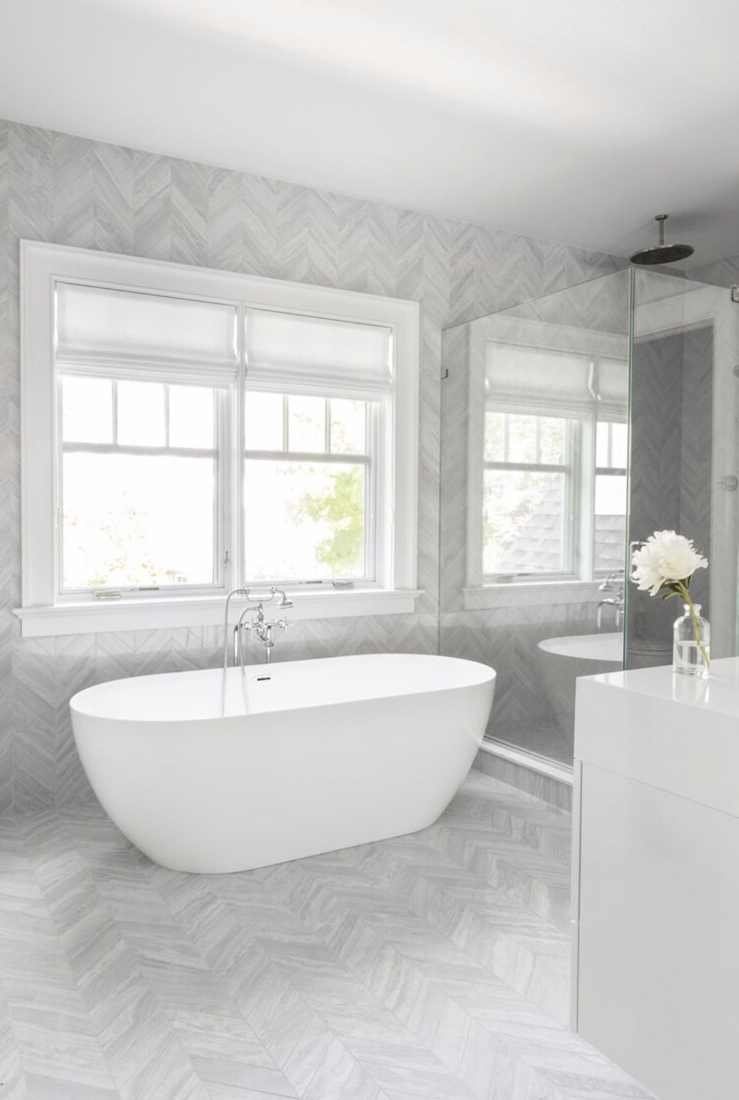 light gray and white chevron tile bathroom
