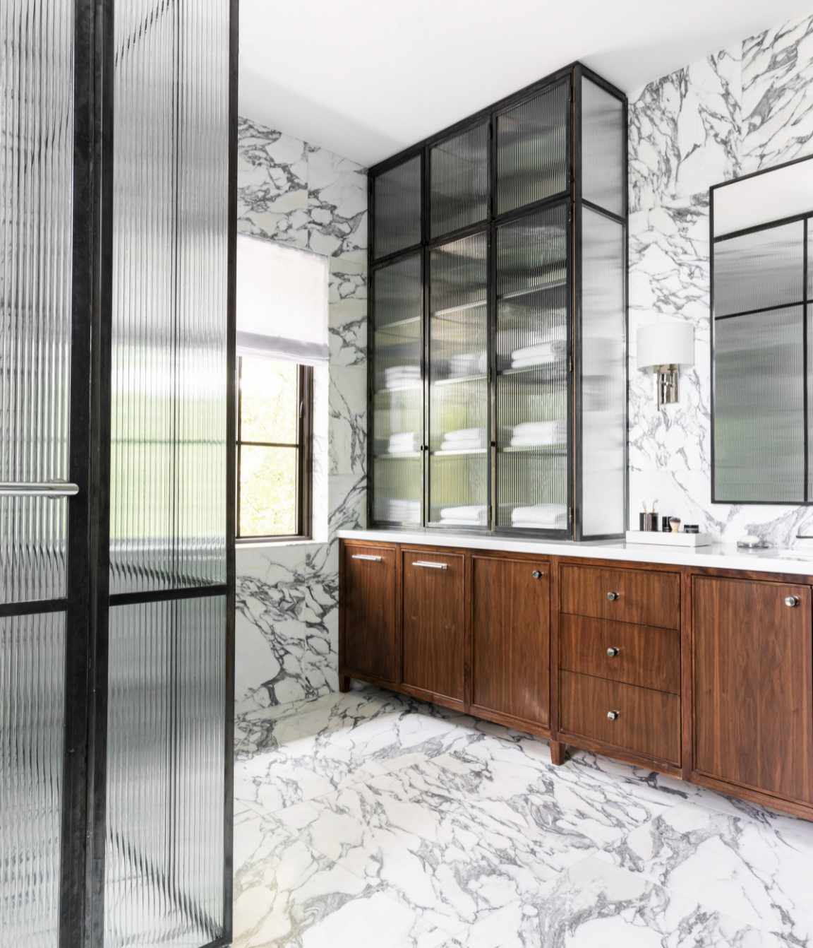 marble gray and white bathroom with wood cabinets